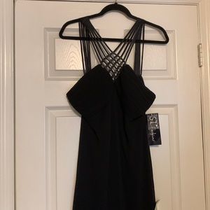 Strappy black evening dress.